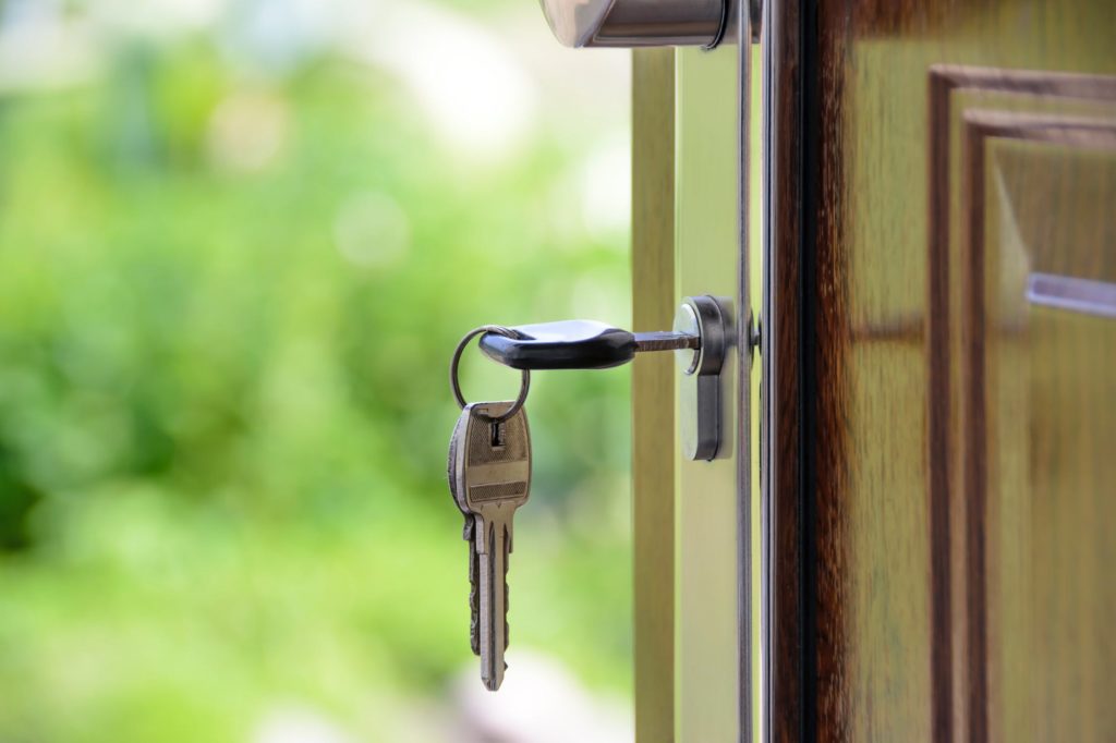 black handled key on key hole